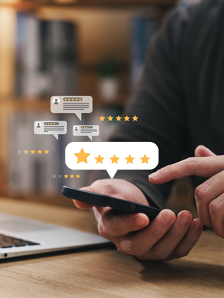 Person holding phone while leaving a 5 City Finance Bank Google review